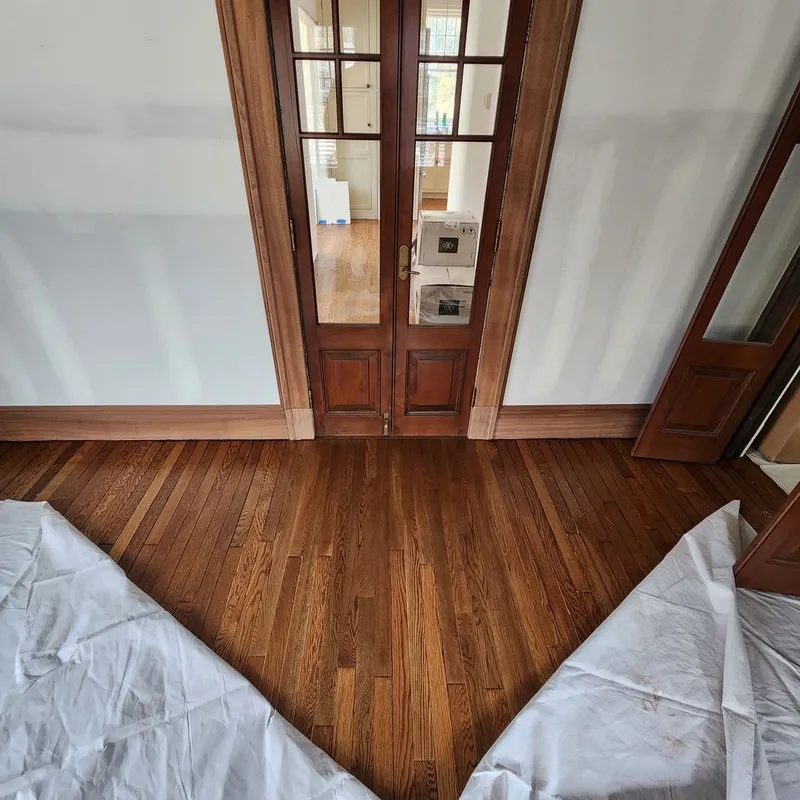 New floorboards weaved seamlessly into an existing 70-year-old oak floor to repair flood damage
