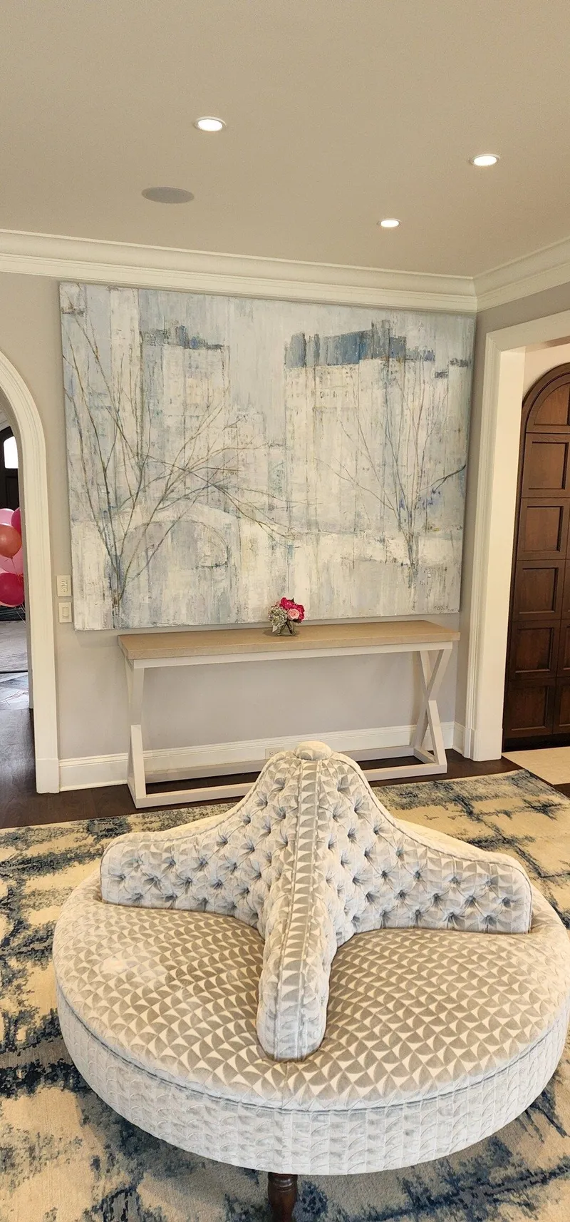 A custom table built to match the art and wall color in a parlor